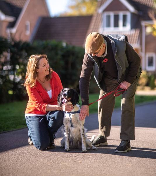 Care companion and client with their dog
