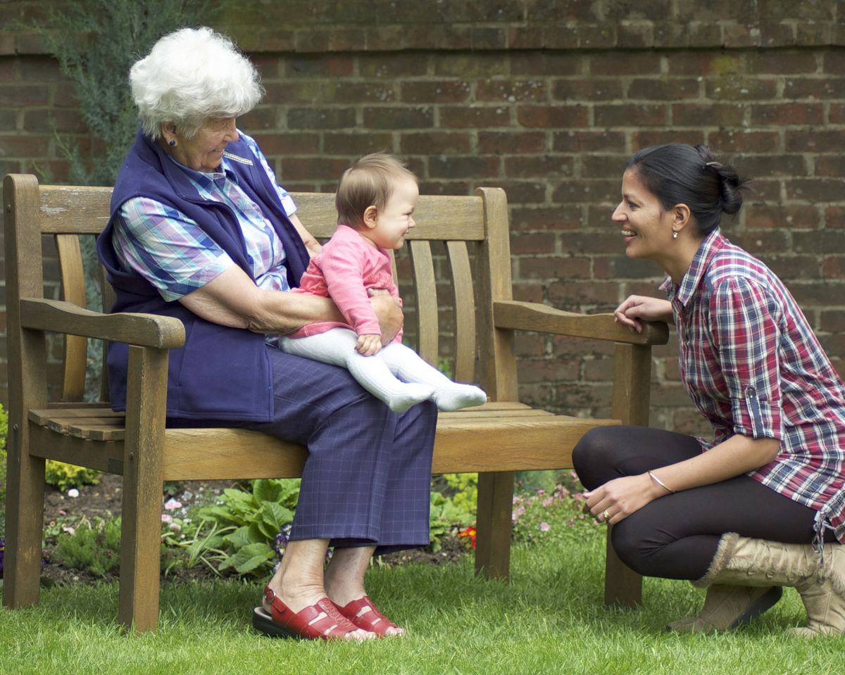 Client in her garden with her family